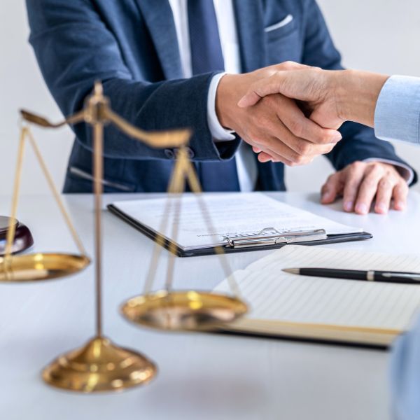 A lawyer and a client shaking hands