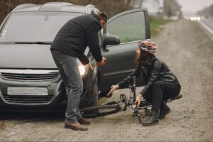 Women on a cycle crashed in a car