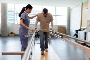 A physiotherapist providing physical therapy to a patient