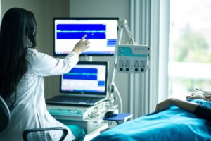 a doctor observing a patient’s brain activity