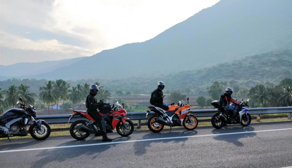 People travelling on motorcycles.