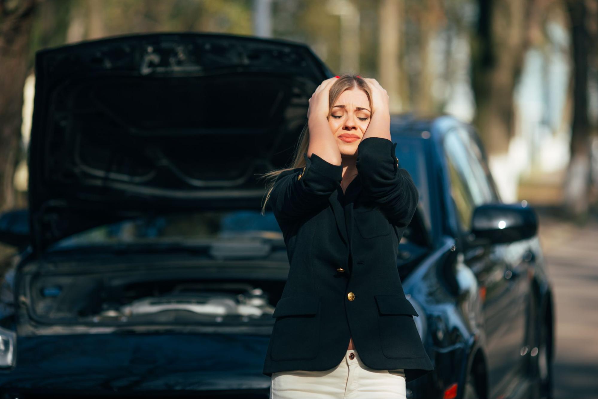 A woman holding her head in her hands