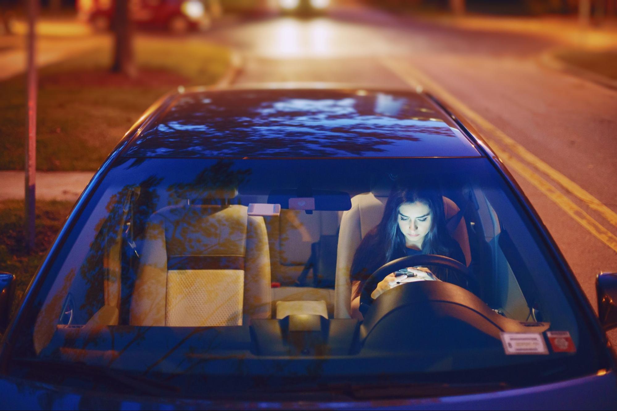 A girl sitting in a car