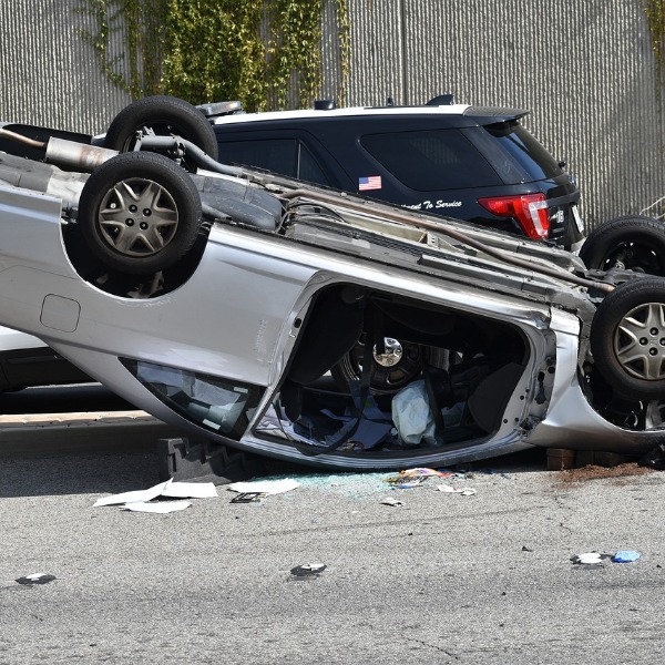 Vehicle overturns leading to neck trauma.