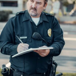 Policeman writing on paper