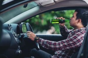 Man drinking and driving