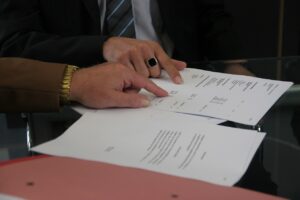 image of two people reviewing a contract