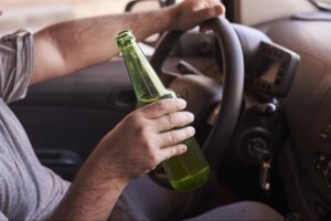 A man drinking while driving